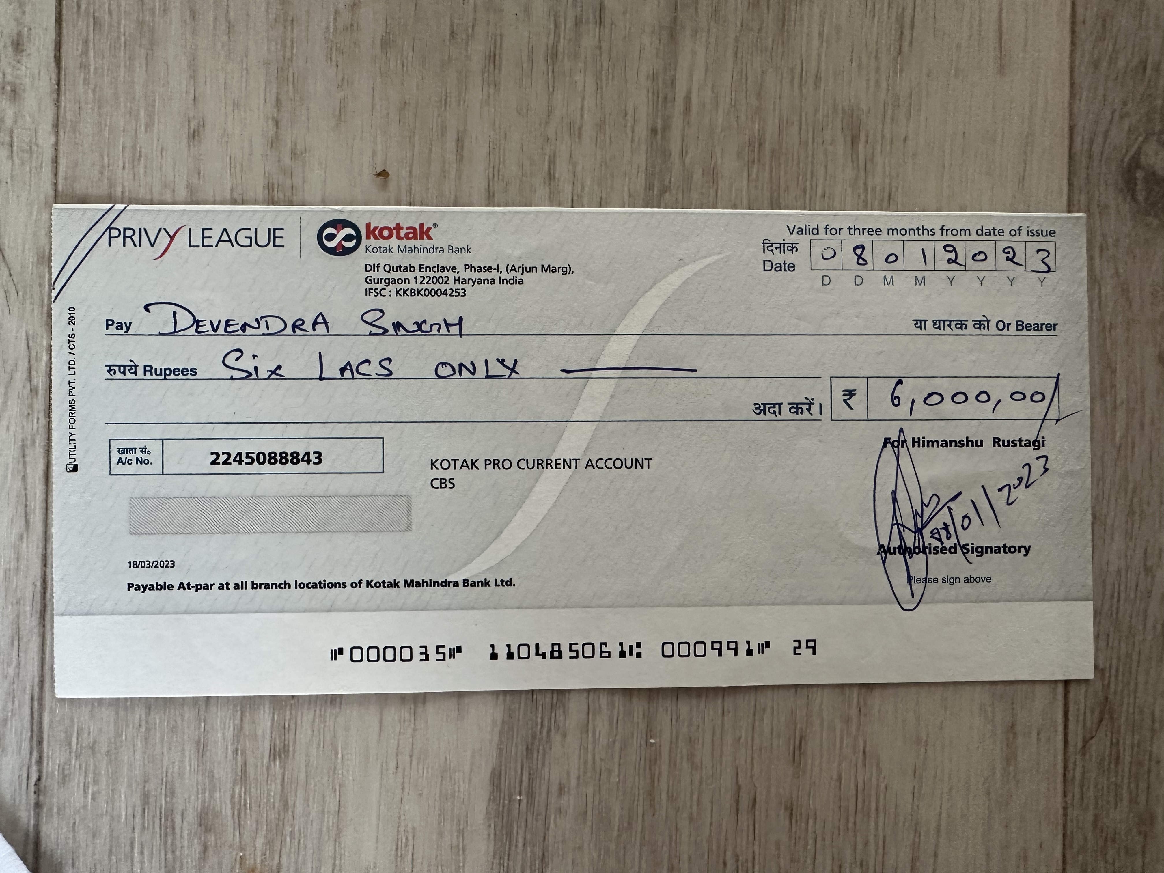 Fraudulent cheque with two impossible dates - printed date 10/03/2023 and issued date 08/01/2023